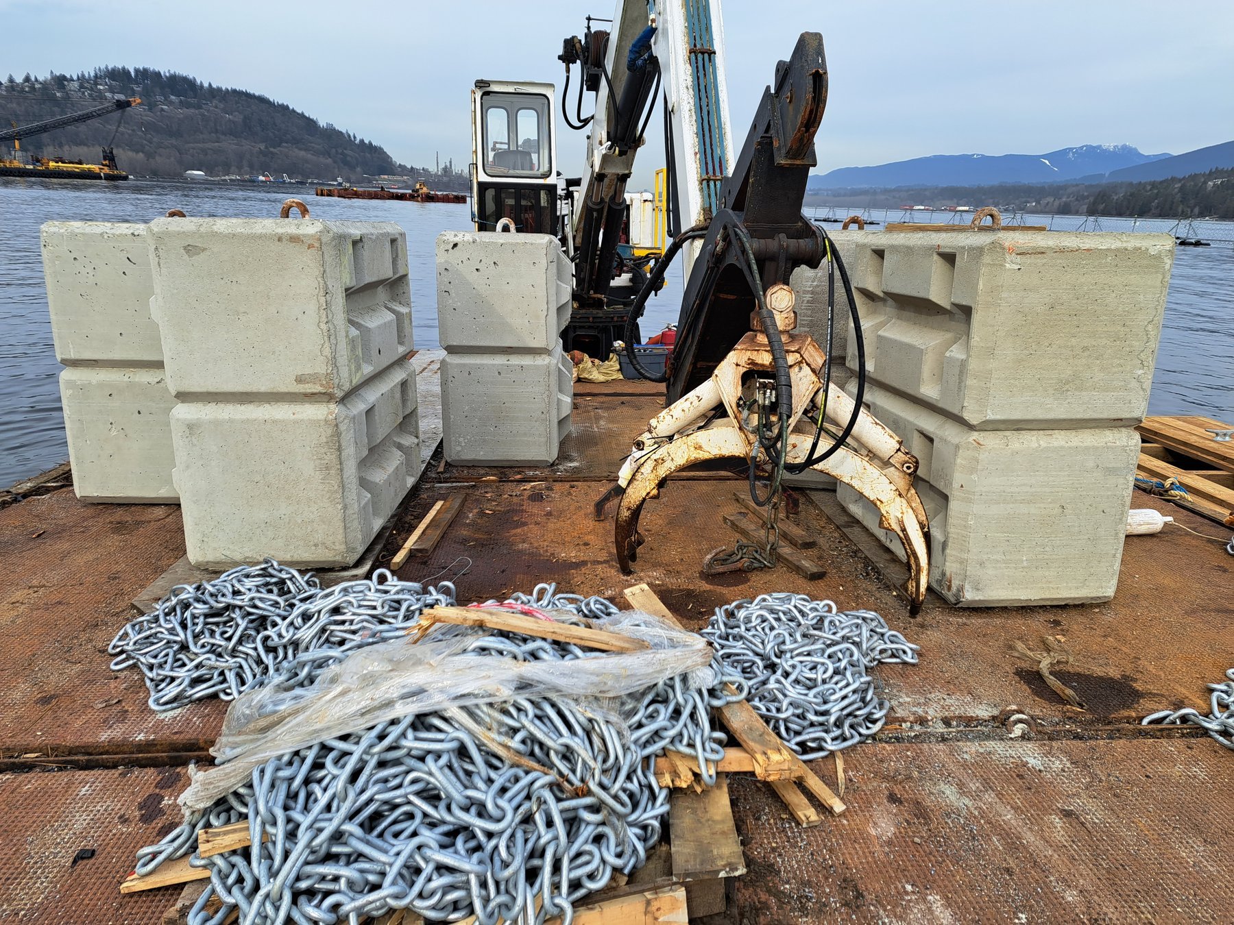 Inspected anchor blocks and galvanized chain prepared for mooring