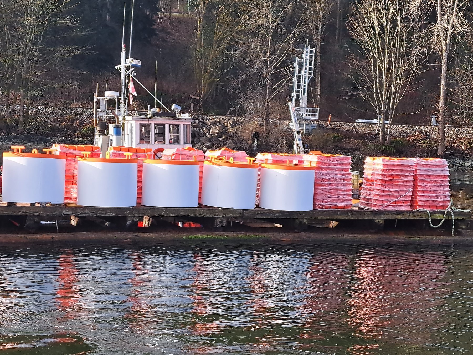 Refurbished marker buoys and boom components ready to return to service