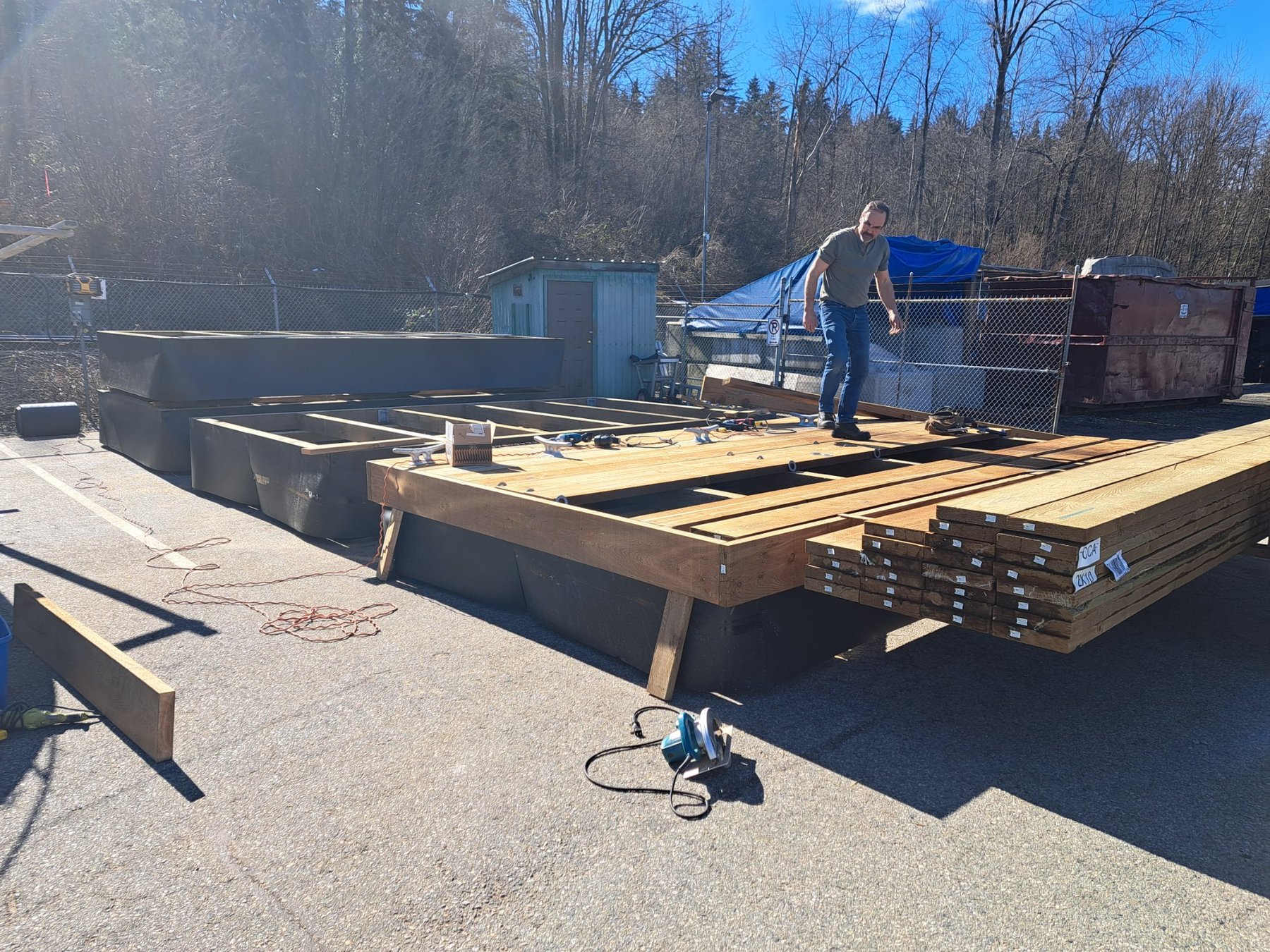 Custom floating dock under construction with treated lumber decking